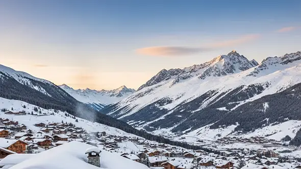 Panoramic view of the snowy Meribel valley with mountain peaks at sunset