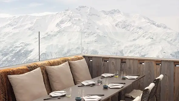 Outdoor terrace restaurant with mountain views for Longevity Cuisine dining.