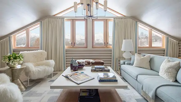 Bright living room with panoramic windows and mountain views.
