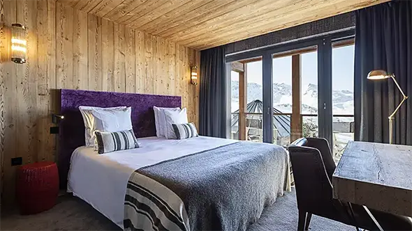 Premium chalet bedroom with mountain view.