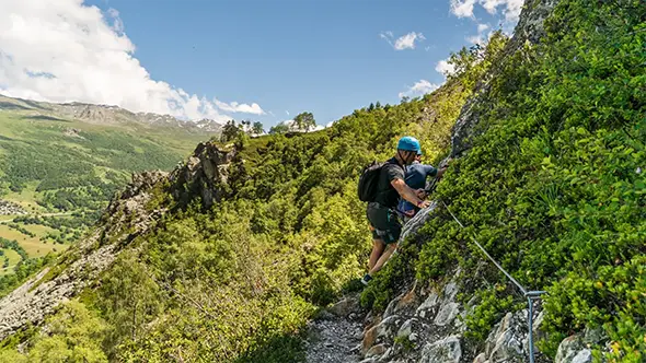 Man on a rocky via ferrata route.