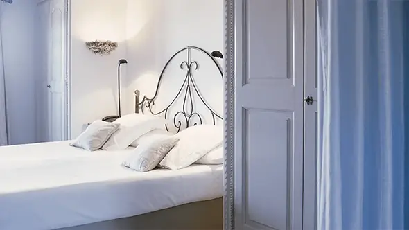 Cozy Classic Room with vintage furniture and a quiet patio view.