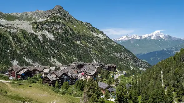 Panoramic view of Arc 1950 village in summer, French Alps.