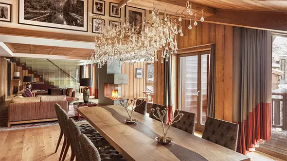 Dining area interior in the Alpine chalet of Fouquet s Courchevel hotel.