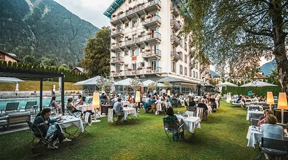 Hotel terrace featuring a swimming pool and restaurant.