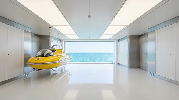 Yellow personal submarine in a high-tech yacht garage.