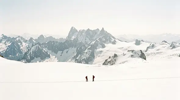 Mountaineers performing an ascent on the Breithorn glacier towards the summit.