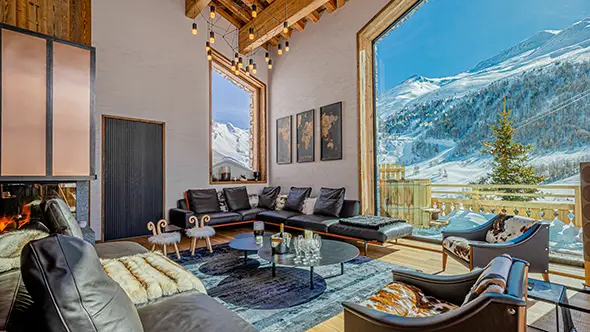 Living room with panoramic mountain views at chalet Orso in Val dIsere