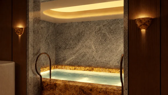 Plunge pool set in a stone alcove for contrast therapy at the Bourbon Hotel spa, Courchevel
