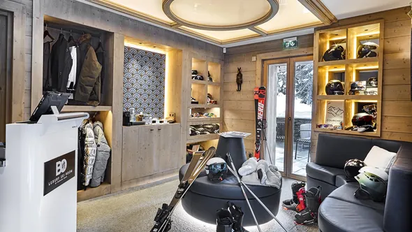 Ski room with ski and boot storage and a door onto the snow at Lys Martagon, Courchevel 1850