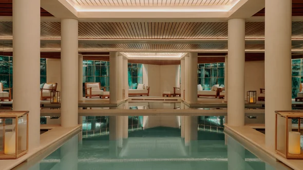 Fourteen-metre indoor pool between stone columns at the Aman Spa, Courchevel 1850