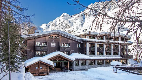Hotel Hermitage in deep snow below the mountains, Breuil-Cervinia