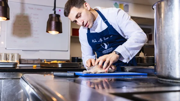 A chef at work in the kitchen of Hotel Pashmina in Val Thorens
