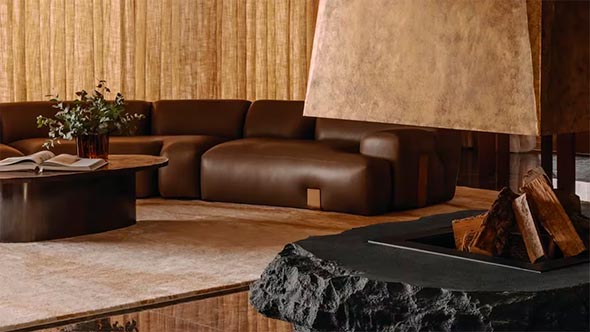 SALTO Lounge with fireplace SALTO lounge area at Rosewood Courchevel featuring a striking stone and copper fireplace.