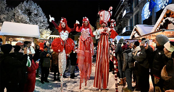 Father Christmas with Bulles de Bonheur magical stilt walkers and illuminations parade in Mottaret