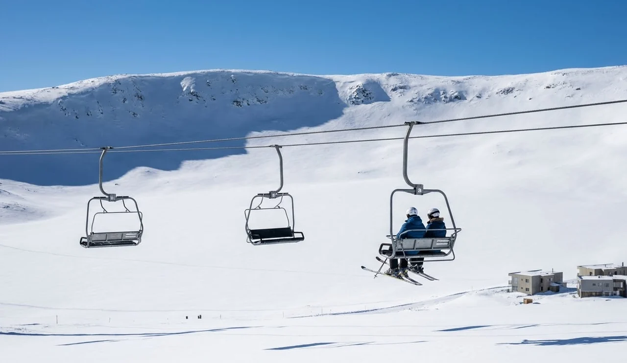 Chairlift over the open, treeless snow basin at Tignes