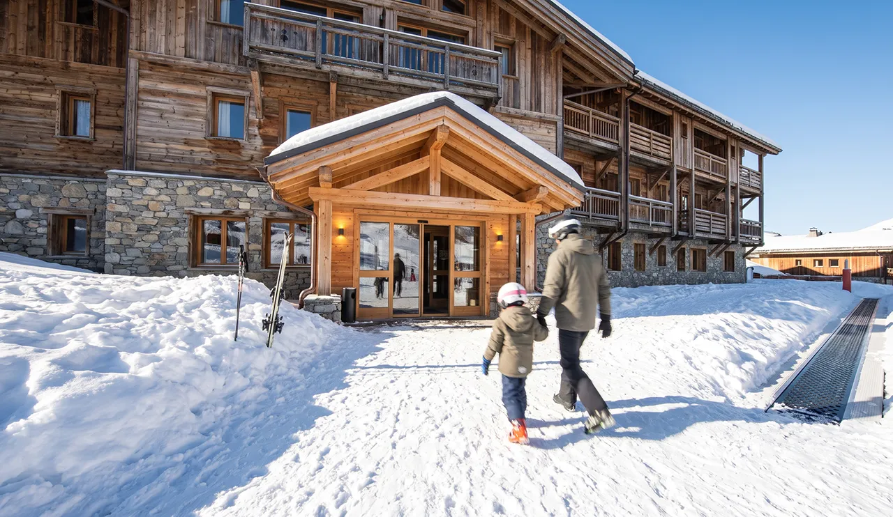 Ski-in ski-out hotel entrance opening straight onto the snow in Courchevel