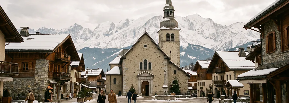 Stone church and houses on a winter Megeve street