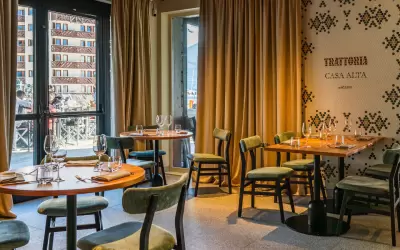 Stylish interior of Casa Alta Italian restaurant with set tables