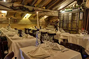 Cozy atmosphere of the L Anerie restaurant in Courchevel