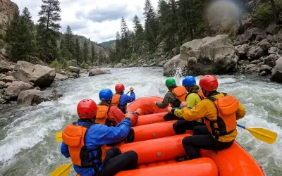 A group of people rafting on an inflatable boat down a mountain river