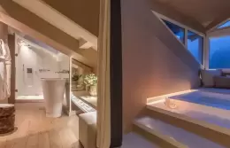 Penthouse Suite master bedroom under the roof beams, Hotel Mont-Blanc Chamonix