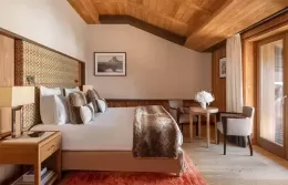 Elegant Prestige room at Fouquets Courchevel with Alpine views.