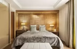 Prestige Room with wood-panelled wall, upholstered bench and desk, Hotel Mont-Blanc Chamonix