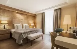 Prestige Room with wood-panelled wall, upholstered bench and desk, Hotel Mont-Blanc Chamonix