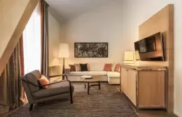 Duplex Suite bedroom with king-size bed and fur throw, Hotel Mont-Blanc Chamonix