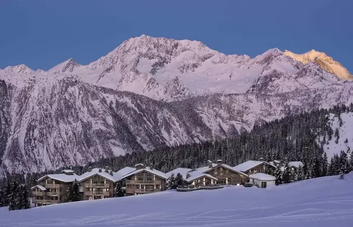 The chalet hamlet against the mountains at Le K2 Altitude, Courchevel 1850
