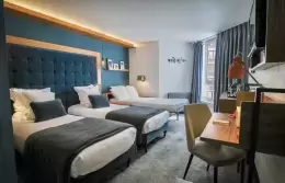 Triple Room with two beds and a desk area at Fahrenheit Seven Val Thorens