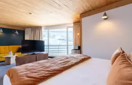 Bedroom and living area of the Top Floor room with mountain view, Fahrenheit Seven Val Thorens