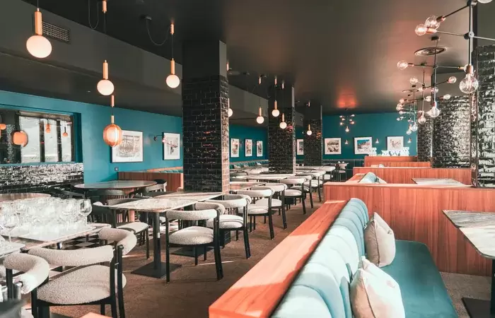 La Rotisserie restaurant with velvet benches and marble tables, Fahrenheit Seven Val Thorens