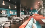 La Rotisserie restaurant with velvet benches and marble tables, Fahrenheit Seven Val Thorens