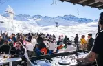 DJ set and apres-ski crowd on the terrace of Fahrenheit Seven Val Thorens