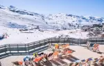 Deckchairs on the panoramic terrace of Fahrenheit Seven Val Thorens above the ski area