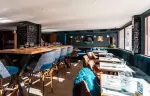 La Rotisserie bistro dining room and bar counter at Fahrenheit Seven Courchevel