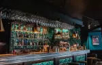 The Seven Kings pub bar with vintage leather and wood interior, Fahrenheit Seven Courchevel