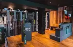Ski rental racks and workshop inside the ski boutique of Fahrenheit Seven Courchevel