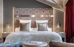 The bed in a Premium Room at Le K2 Djola, Courchevel 1850