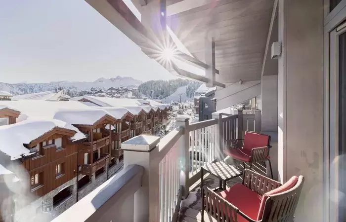 A balcony terrace overlooking the village at Le K2 Djola, Courchevel 1850