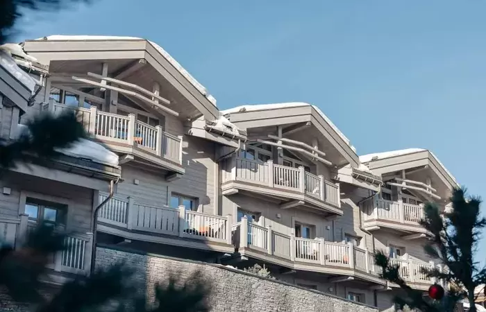 The hotel facade and balconies at Le K2 Djola, Courchevel 1850