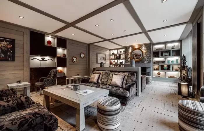 The lounge with a fireplace at Le K2 Djola, Courchevel 1850