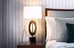 Bedside lamp and pillows in a Nest Room at Chenot Palace Weggis, Lake Lucerne