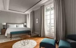 A Panorama Lake View Classic room with a king-size bed and balcony doors, Chenot Palace Weggis