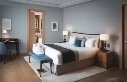 An Executive Room with a king-size bed and a writing desk at Chenot Palace Weggis