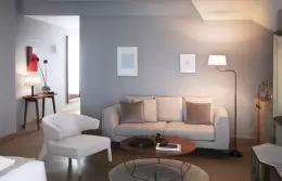 The sitting area with a sofa and armchair in an Executive Room, Chenot Palace Weggis