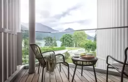 A balcony with wicker chairs overlooking the lake, Panorama Lake View Deluxe, Chenot Palace Weggis