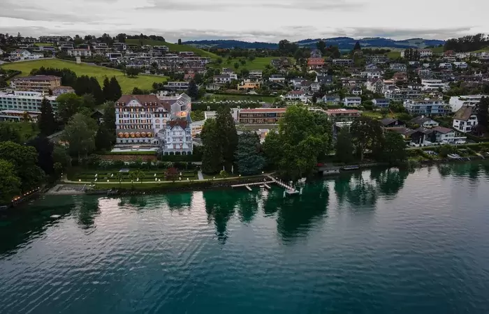 Aerial view of the hotel on the shore of Lake Lucerne in Weggis, Chenot Palace Weggis